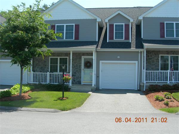159 Allen Road, Unit 15 Billerica, MA 01821 - Photo 1 of 21 a front view of a house with a garden and plants