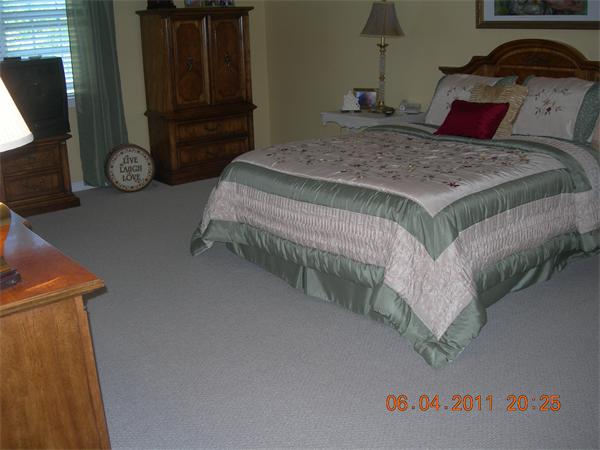 159 Allen Road, Unit 15 Billerica, MA 01821 - Photo 15 of 21 a bedroom with a bed and a mirror