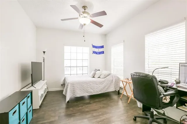 a bedroom with furniture and a window