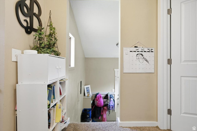 565 East 800 North Logan, UT 84321 - Photo 14 of 27 Hallway with a neutral wall color, white trim, and textured carpet flooring