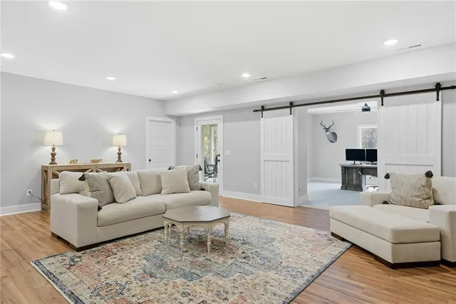 a living room with furniture and a rug