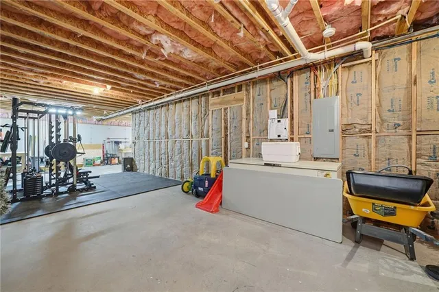 a living room with furniture a fireplace and a flat tv screen