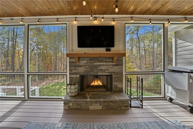 a view of a deck with wooden floor and outer view