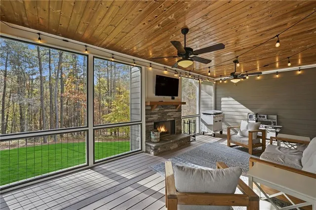 a view of a house with a yard and sitting area