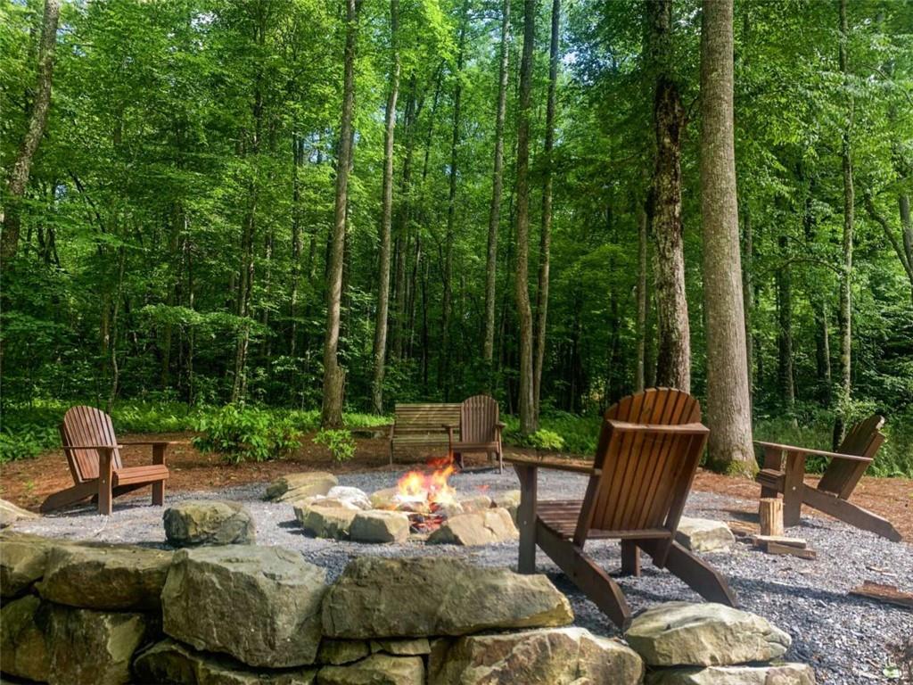 142 Twisted Oak Road Talking Rock, GA 30175 - Photo 16 of 18 a view of backyard with furniture and outdoor seating