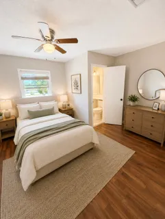 a bedroom with a bed and a dresser