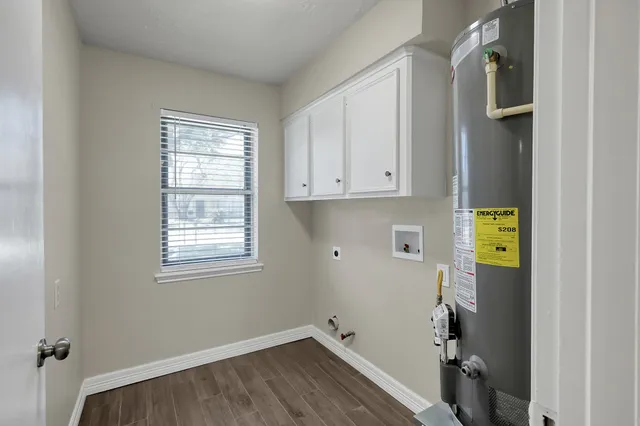a room with a window and wooden floor