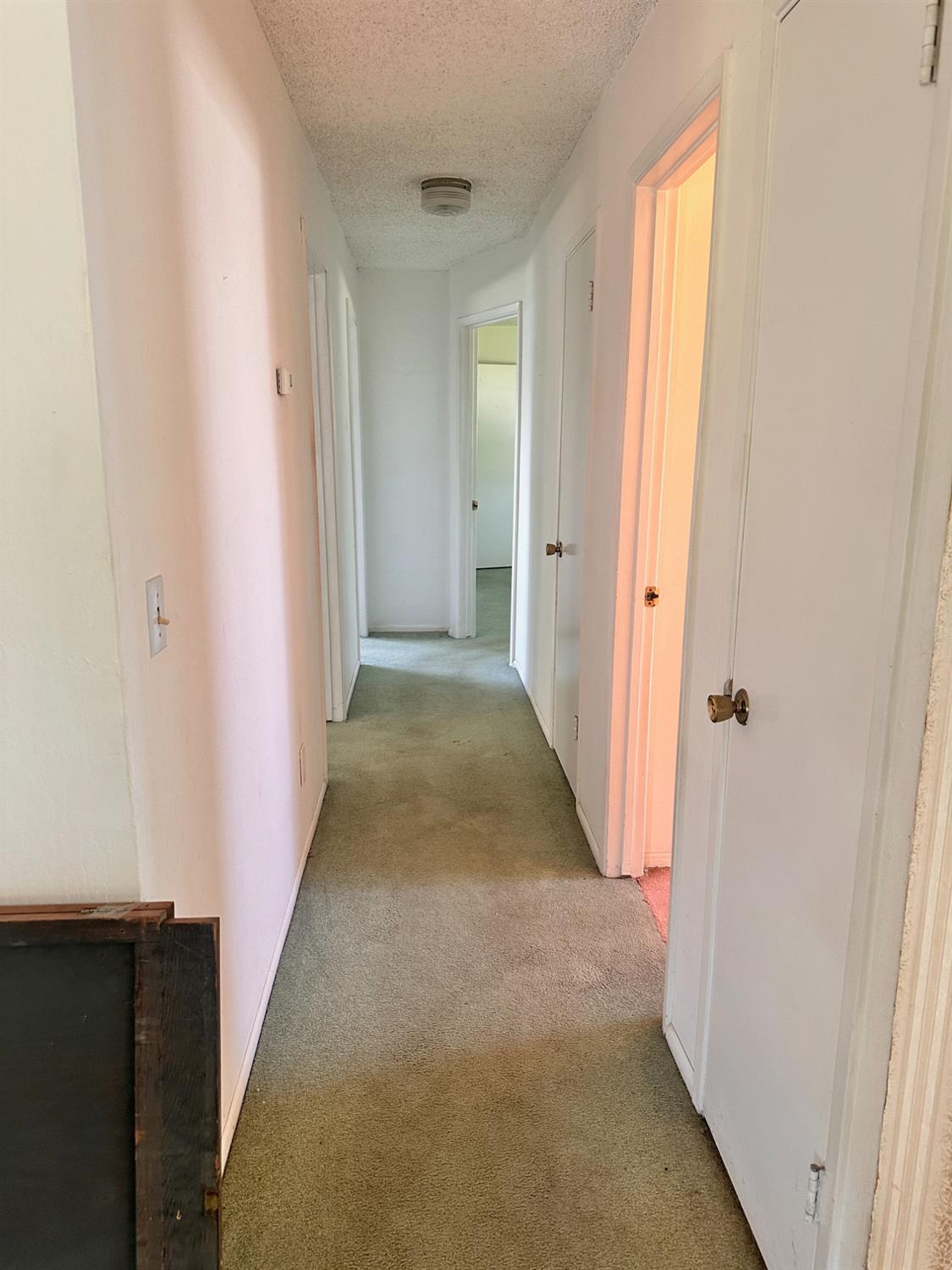 3207 Terry Way Carmichael, CA 95608 - Photo 15 of 36 a view of a hallway with wooden floor and closet