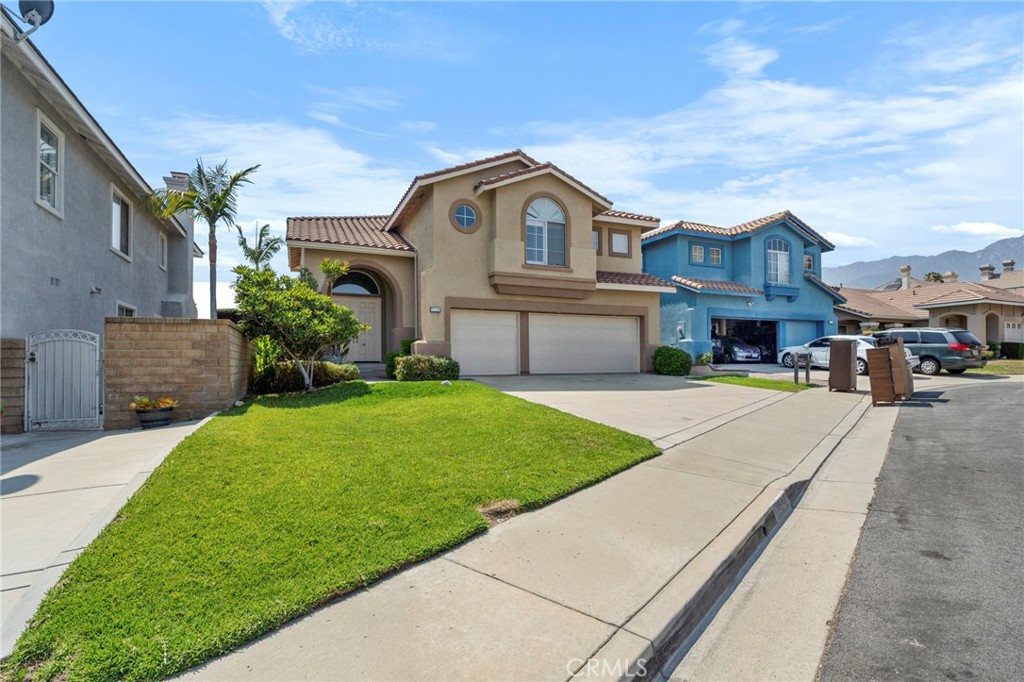 7116 Sapri Place Rancho Cucamonga, CA 91701 - Photo 11 of 52 a front view of a house with a yard
