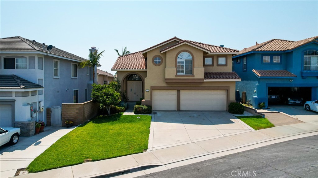 7116 Sapri Place Rancho Cucamonga, CA 91701 - Photo 2 of 52 a front view of house with yard and green space