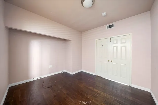 a view of a livingroom with furniture and a flat screen tv