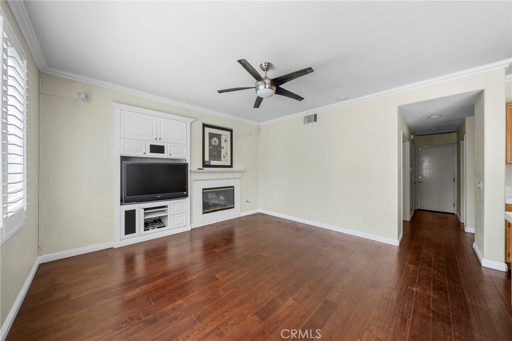 7116 Sapri Place Rancho Cucamonga, CA 91701 - Photo 24 of 52 a view of a livingroom with furniture and a flat screen tv