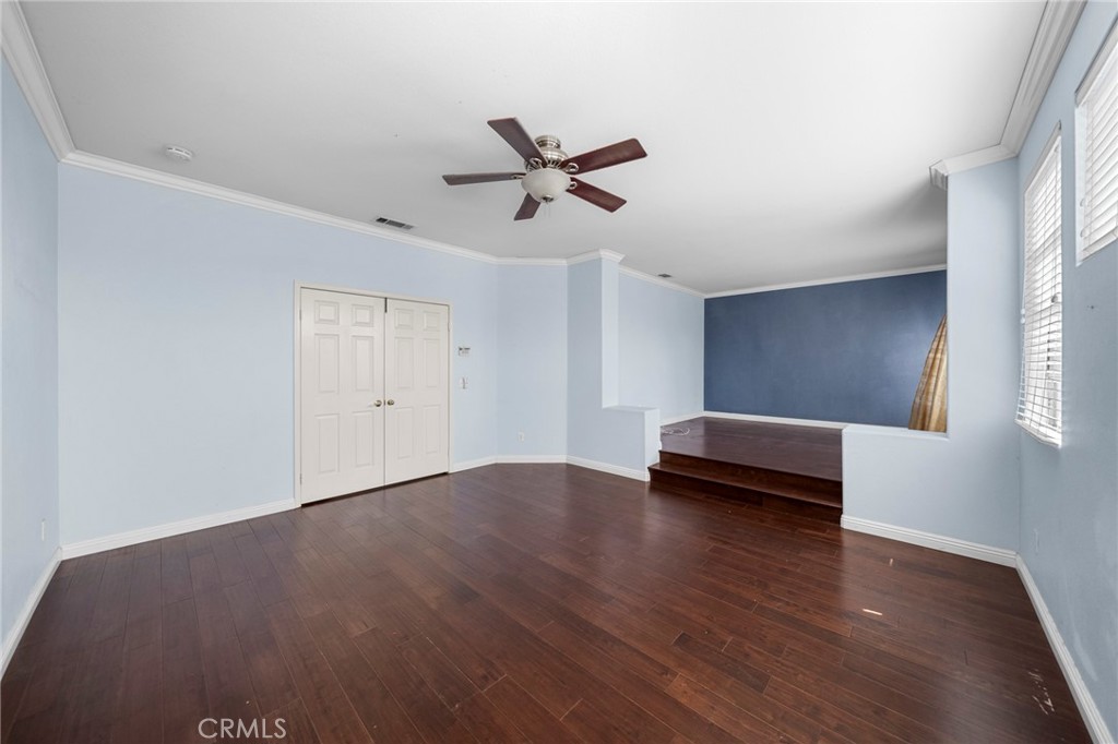 7116 Sapri Place Rancho Cucamonga, CA 91701 - Photo 35 of 52 wooden floor in an empty room with a window