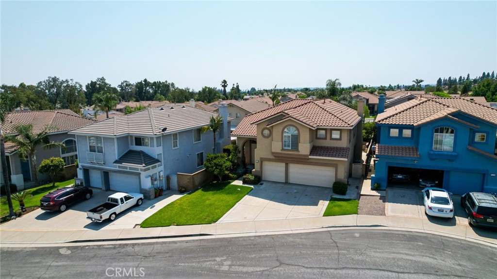 7116 Sapri Place Rancho Cucamonga, CA 91701 - Photo 4 of 52 a front view of house with yard and green space
