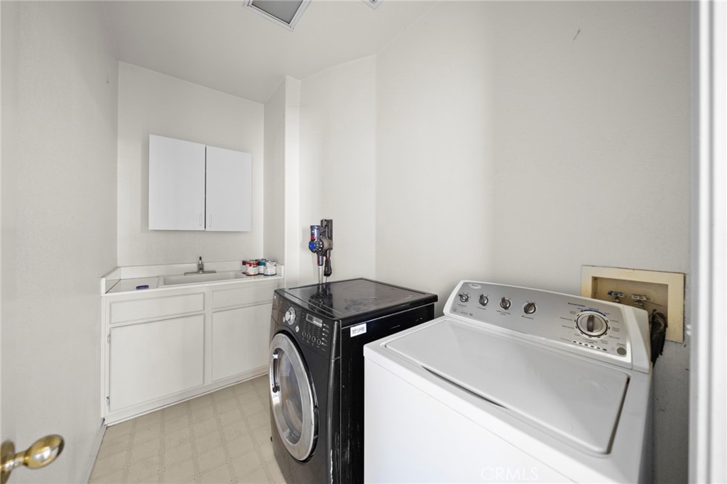 7116 Sapri Place Rancho Cucamonga, CA 91701 - Photo 48 of 52 a utility room with dryer and washer