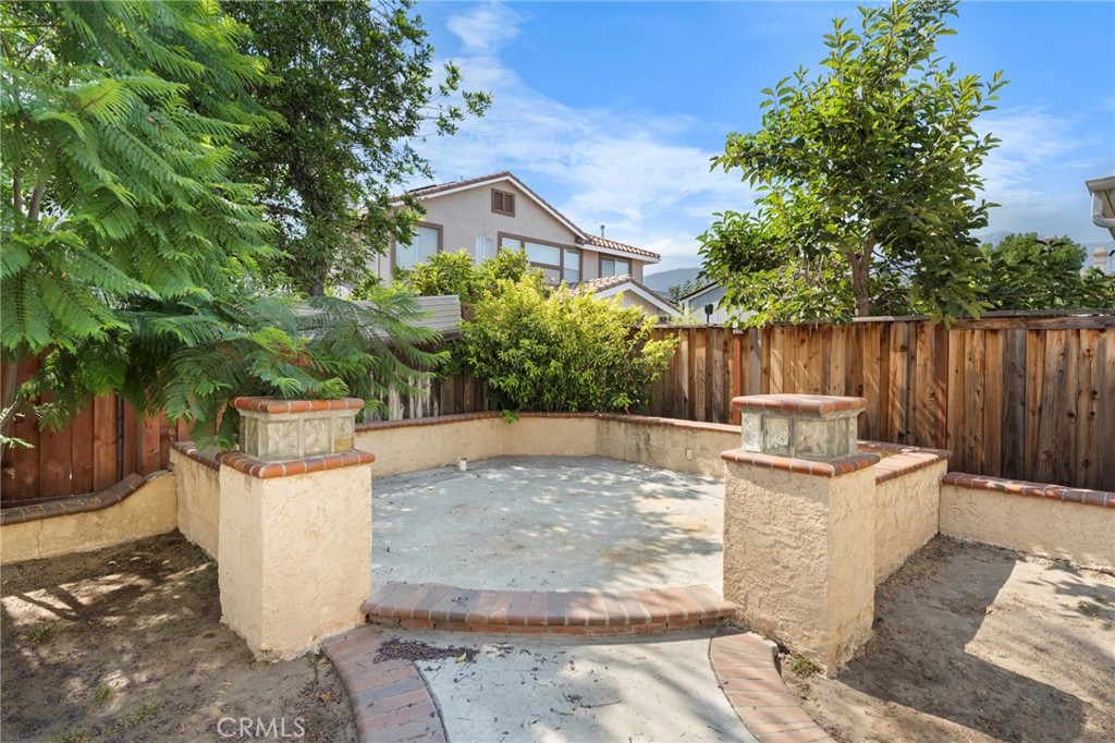 7116 Sapri Place Rancho Cucamonga, CA 91701 - Photo 50 of 52 a view of a chairs and table in backyard