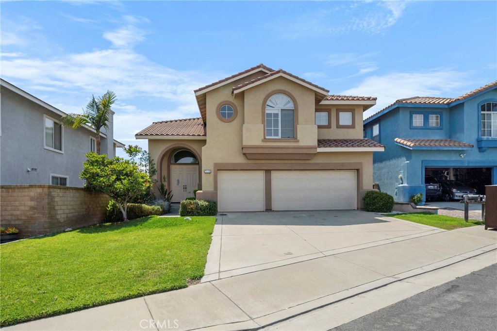 7116 Sapri Place Rancho Cucamonga, CA 91701 - Photo 10 of 52 a front view of a house with garden