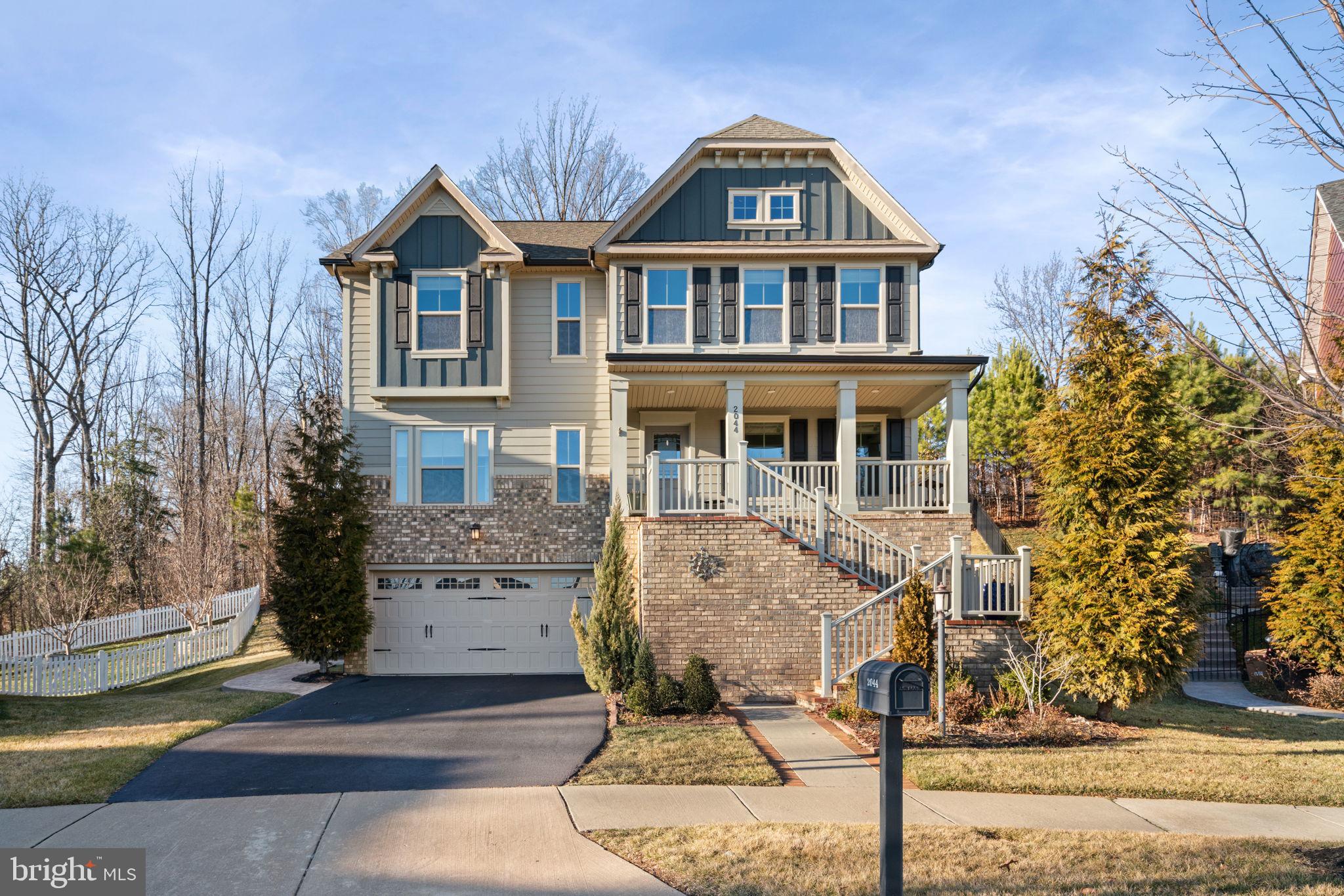a front view of a house with parking