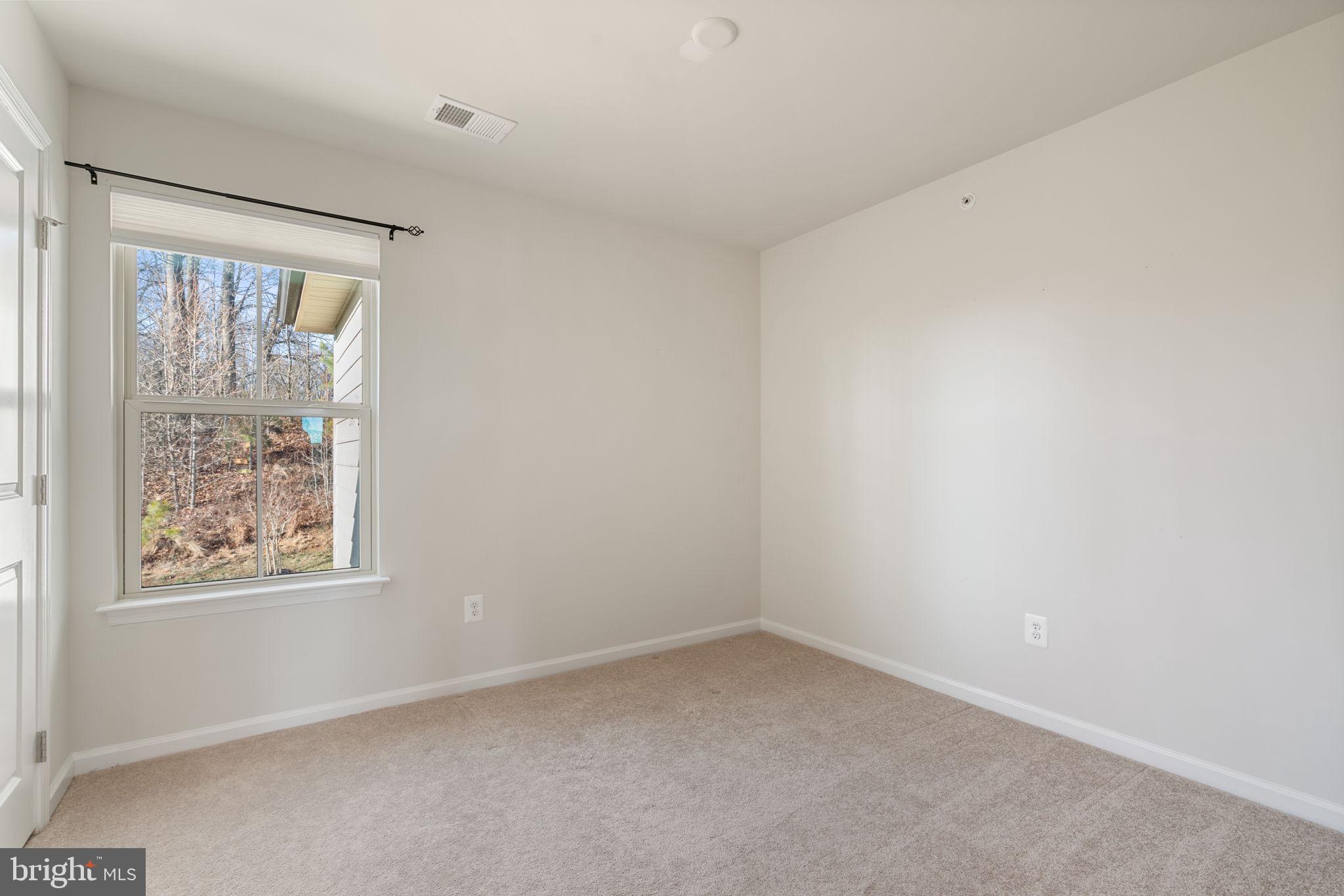 2044 Scarlet Pine Road Dumfries, VA 22026 - Photo 32 of 85 an empty room with a window