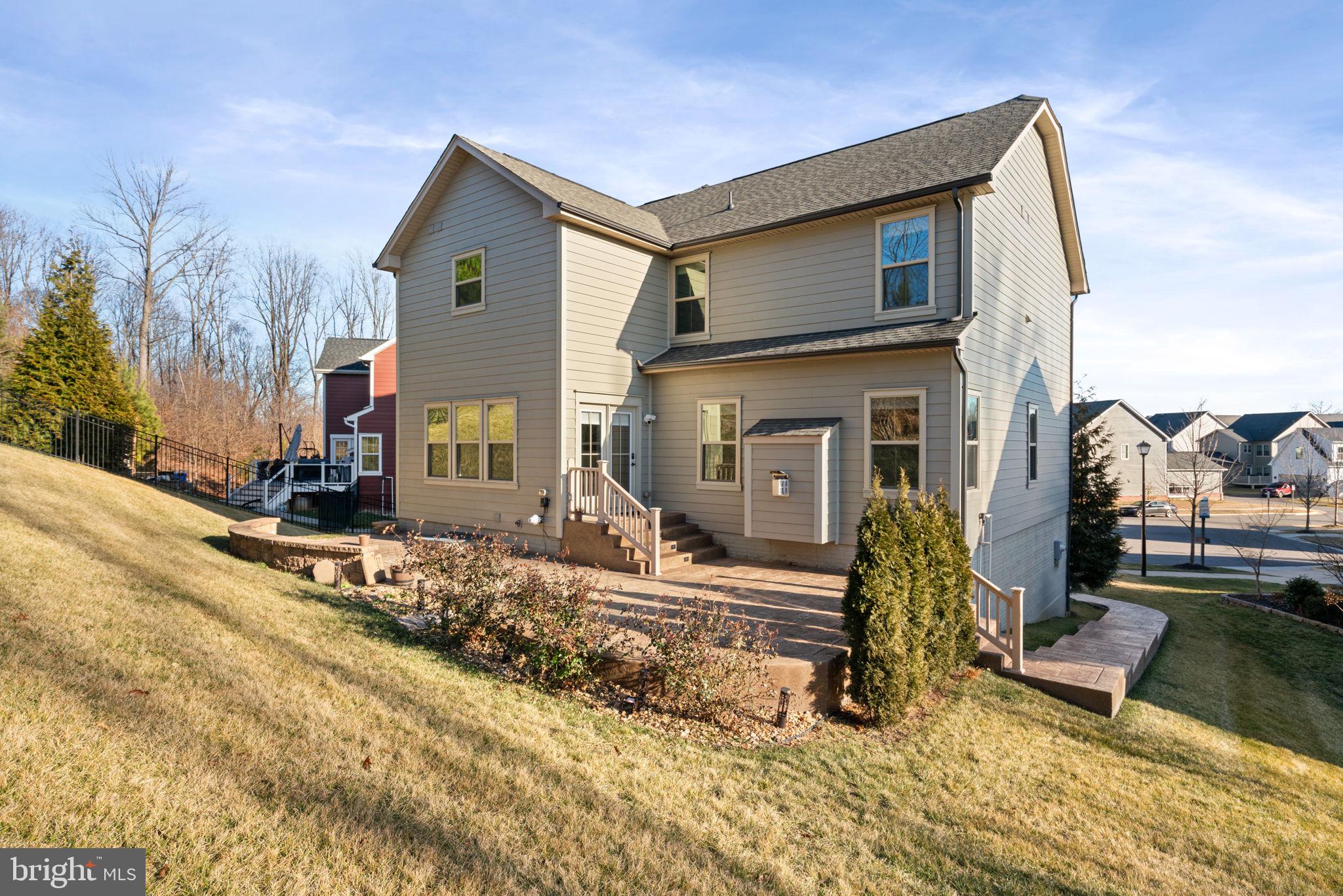 2044 Scarlet Pine Road Dumfries, VA 22026 - Photo 48 of 85 a front view of a house with a yard