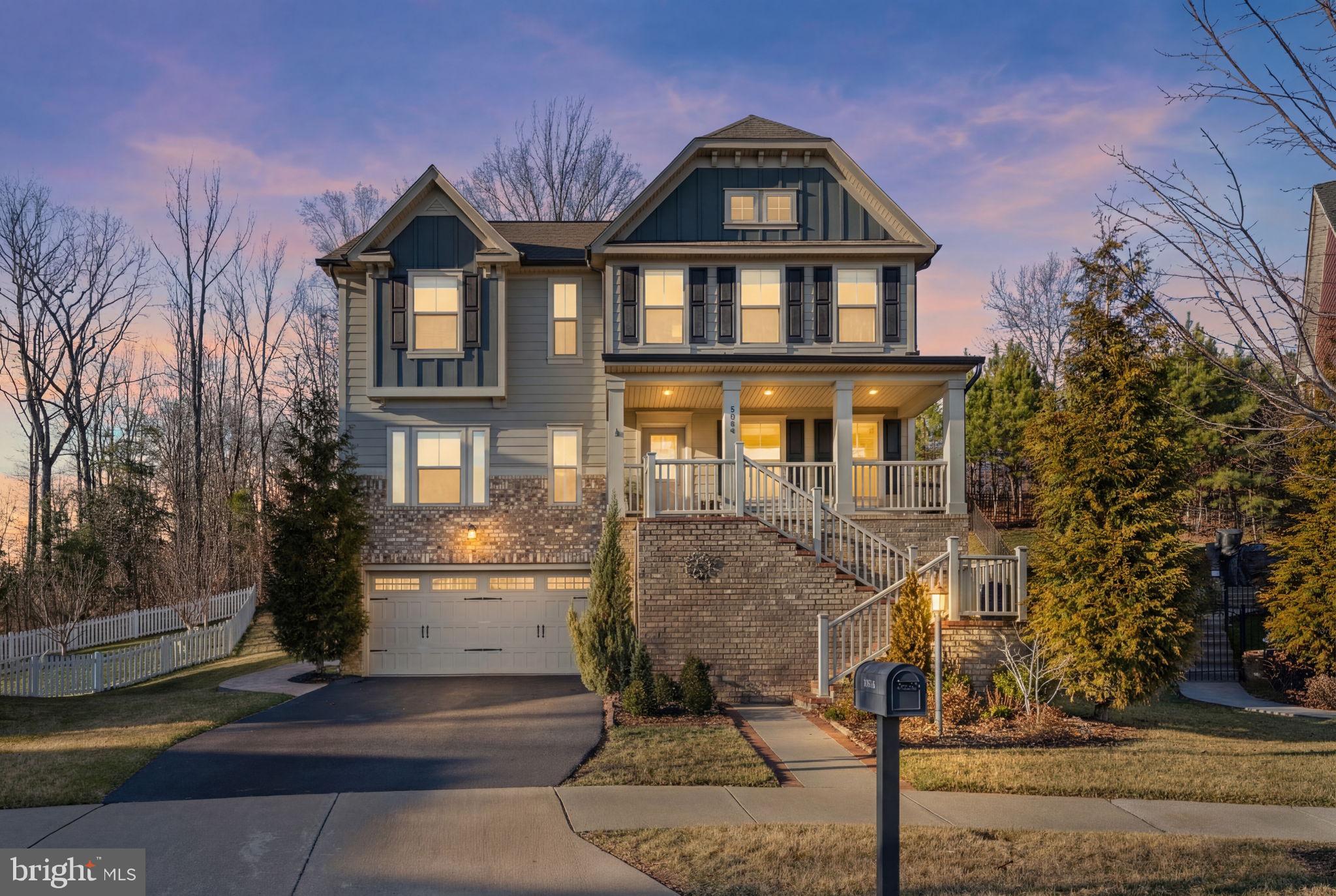 2044 Scarlet Pine Road Dumfries, VA 22026 - Photo 52 of 85 a front view of a house with a yard