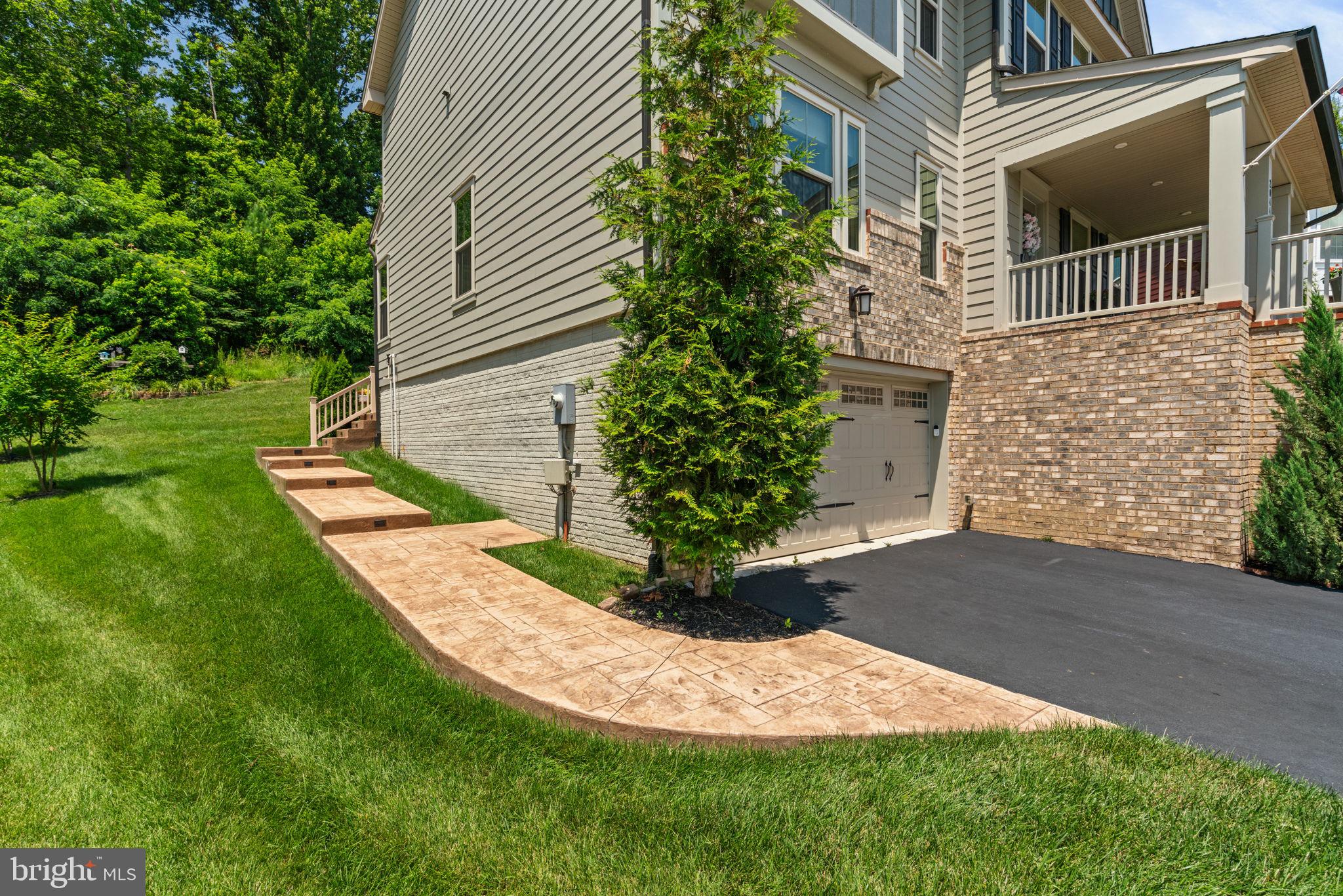 2044 Scarlet Pine Road Dumfries, VA 22026 - Photo 56 of 85 a view of a house with a yard