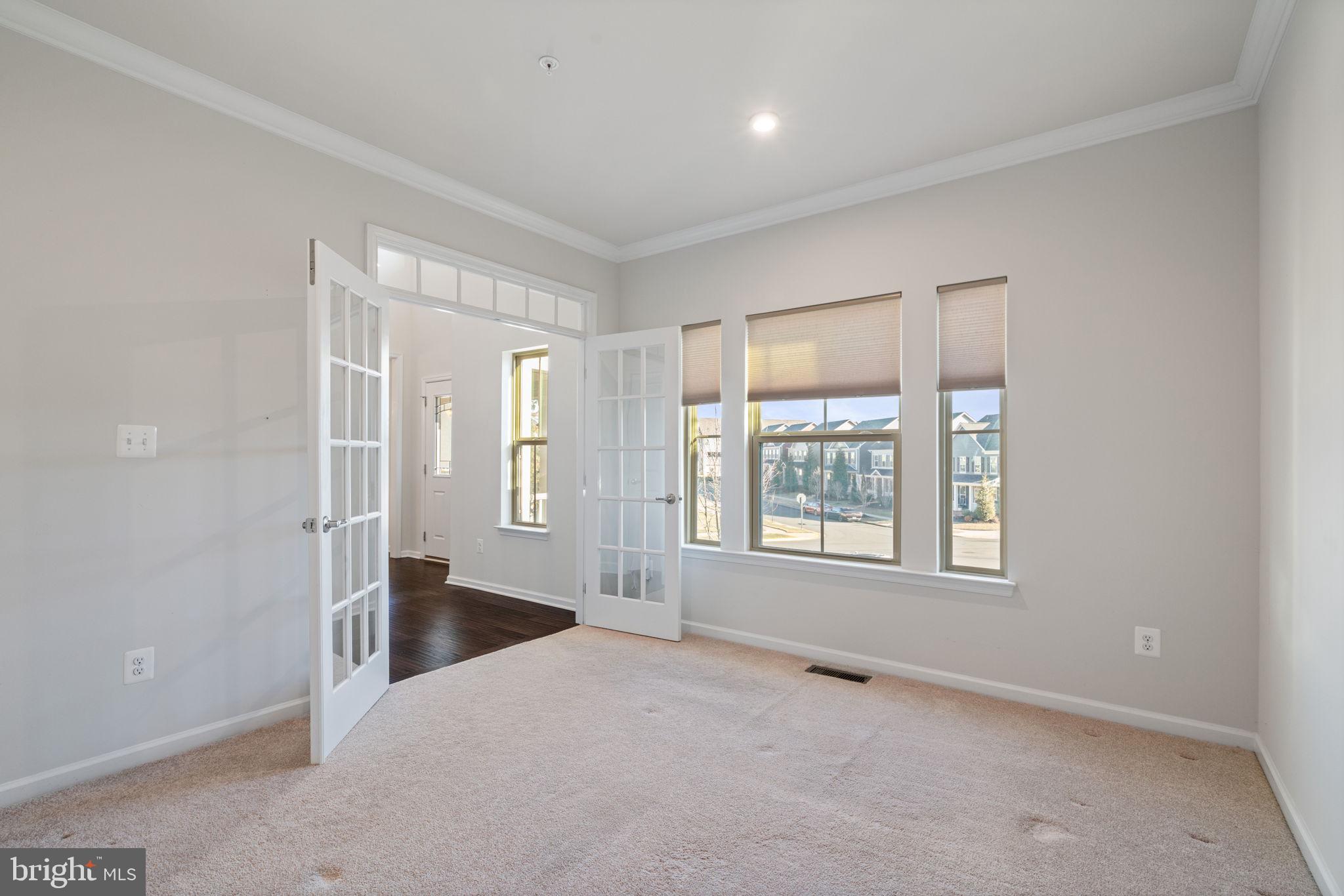 2044 Scarlet Pine Road Dumfries, VA 22026 - Photo 6 of 85 a view of an empty room with a window