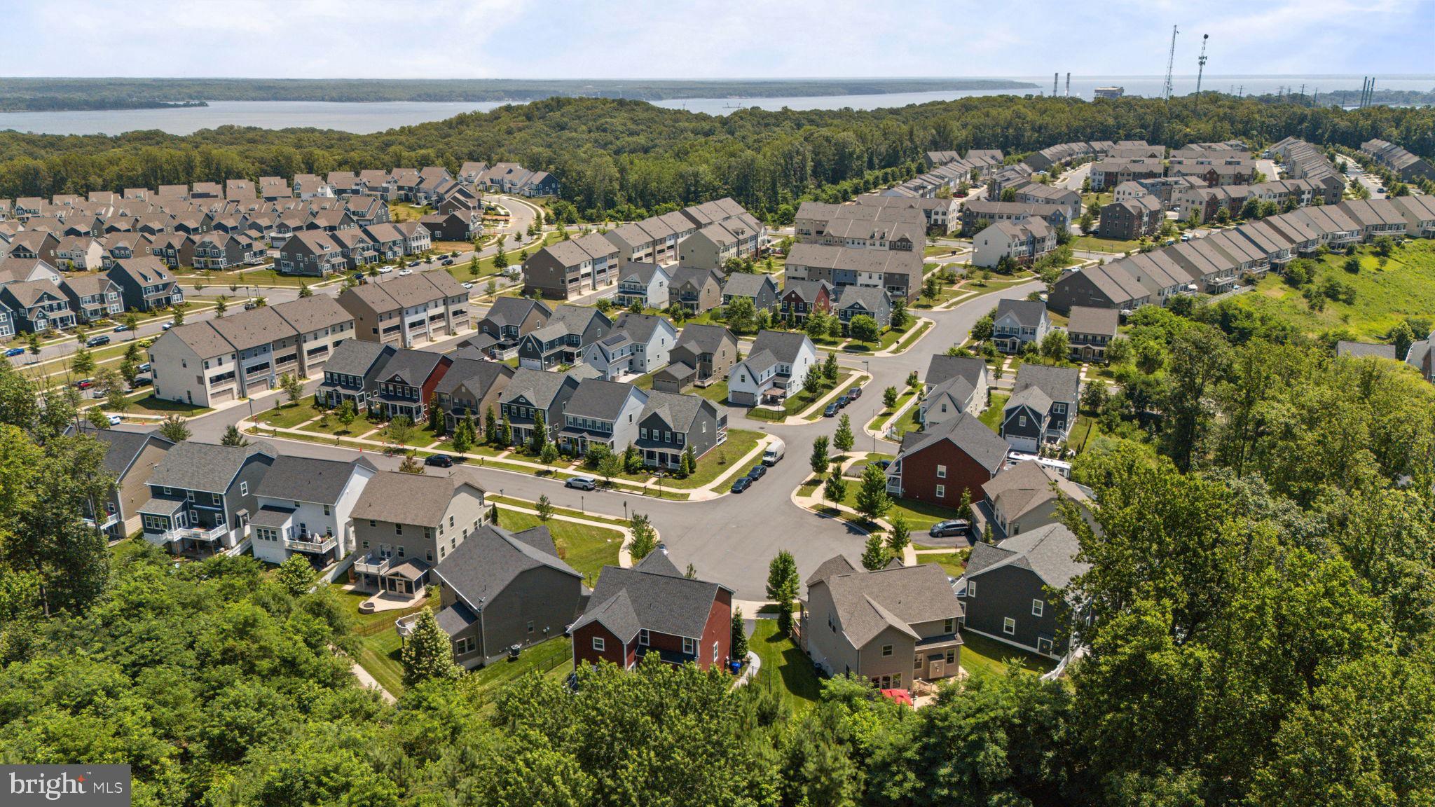 2044 Scarlet Pine Road Dumfries, VA 22026 - Photo 66 of 85 an aerial view of a city with lots of residential buildings