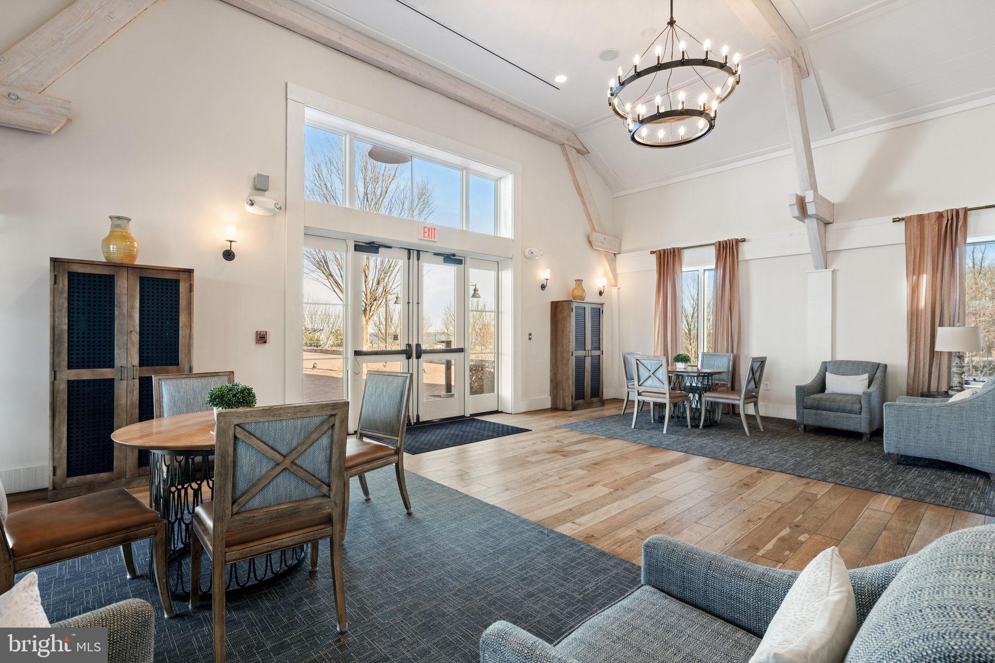 2044 Scarlet Pine Road Dumfries, VA 22026 - Photo 73 of 85 a living room with furniture kitchen view and a chandelier