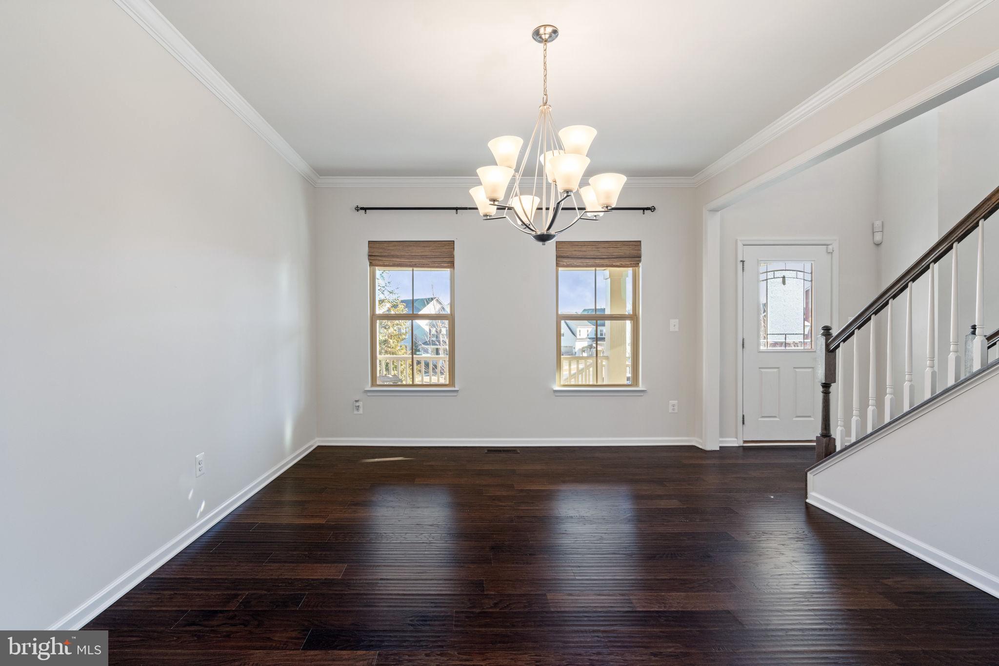 2044 Scarlet Pine Road Dumfries, VA 22026 - Photo 10 of 85 a view of a room with wooden floor chandelier and windows