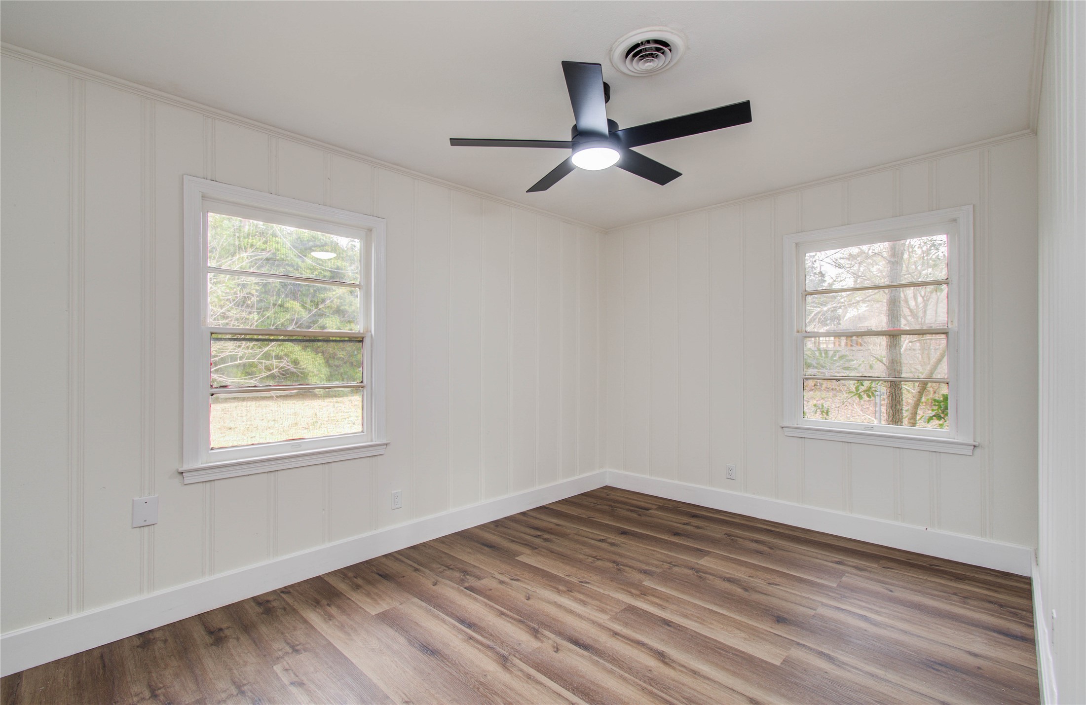 2417 Pecan Street Dickinson, TX 77539 - Photo 32 of 43 a view of empty room with wooden floor and fan