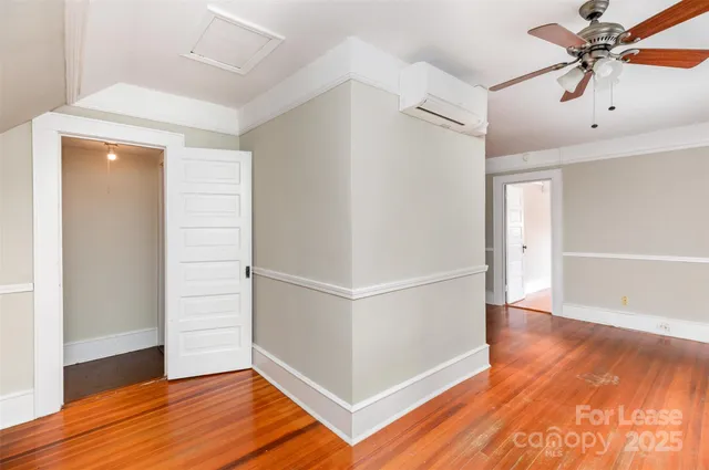 a view of a livingroom with wooden floor
