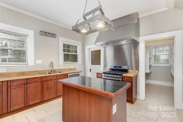 a kitchen that has a sink and cabinets
