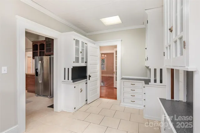 a view of a kitchen with refrigerator sink and an oven