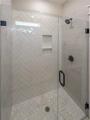 a bathroom with double vanity sink and a mirror