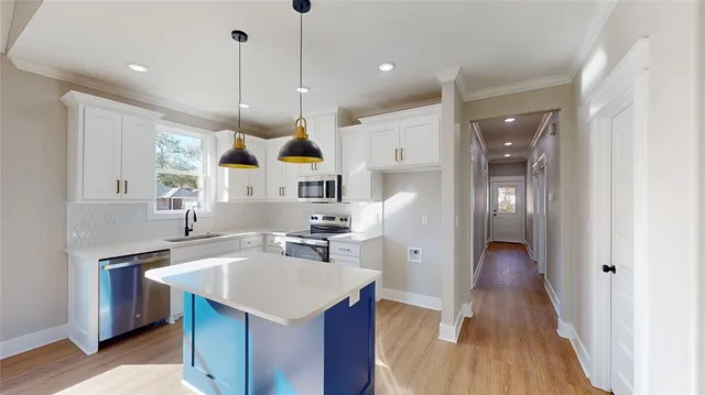 an empty room with closet and a ceiling fan