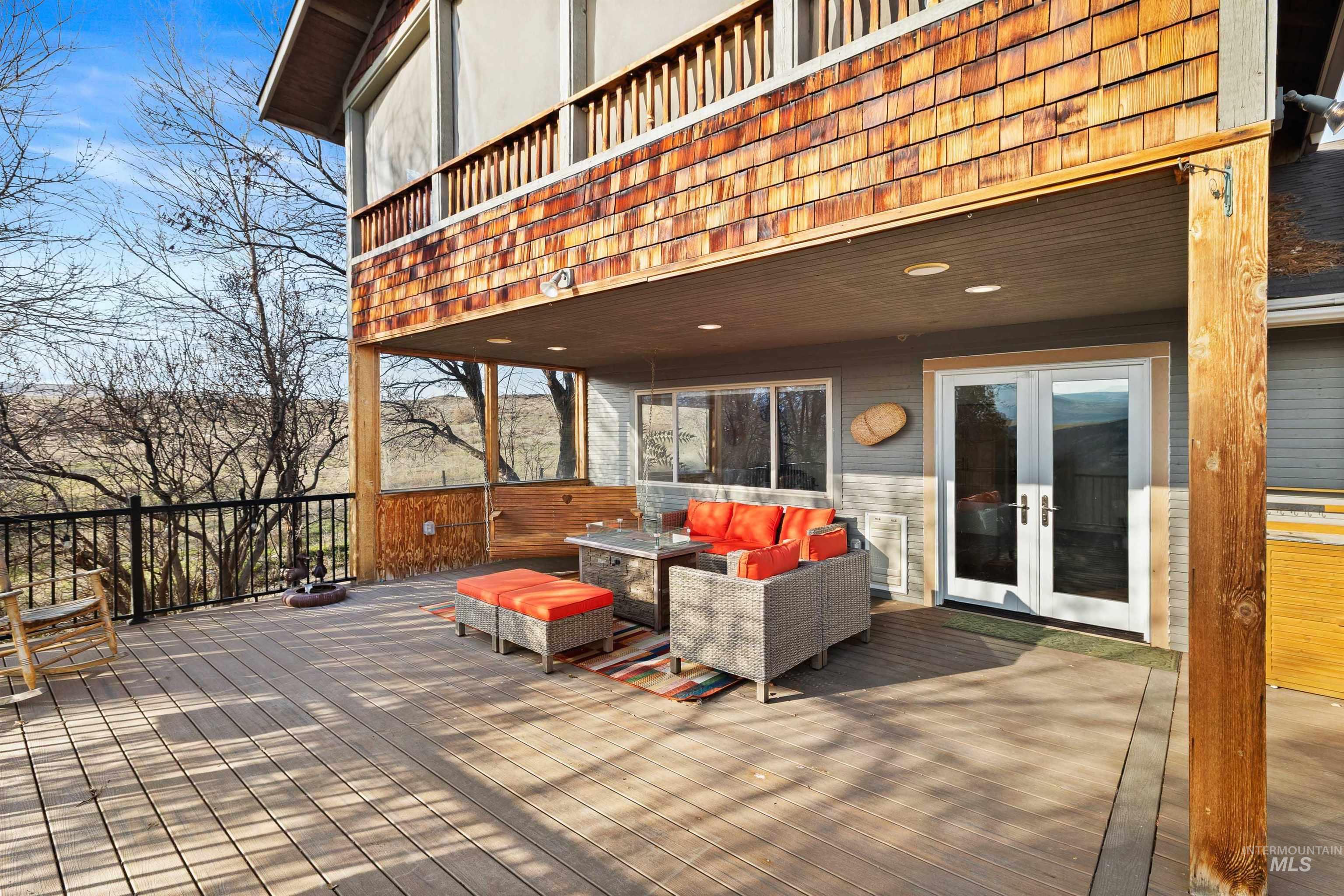853 Pottery Road Bliss, ID 83314 - Photo 32 of 50 Wooden terrace featuring an outdoor hangout area and french doors