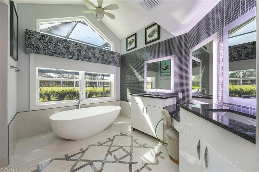 550 Cormorant Cove Naples, FL 34113 - Photo 16 of 39 a bath tub sitting next to a window