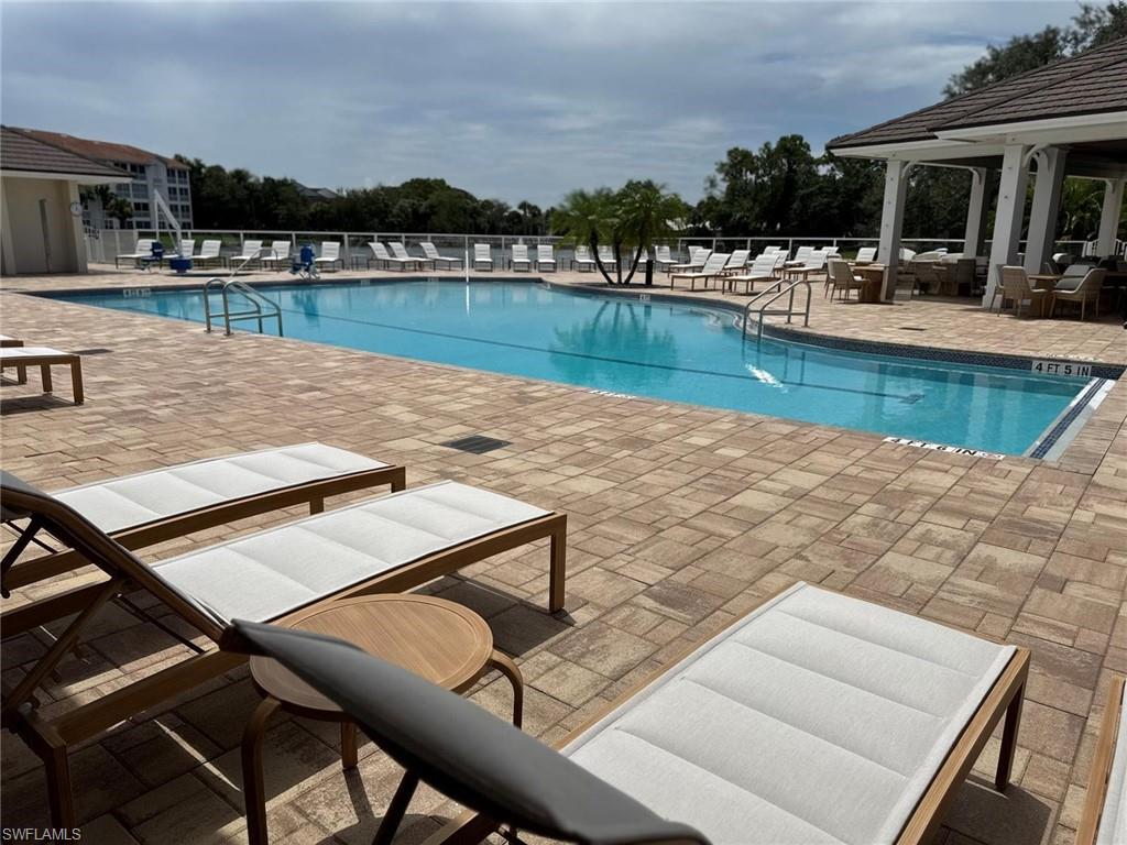 550 Cormorant Cove Naples, FL 34113 - Photo 37 of 39 a view of a patio with chairs and a table