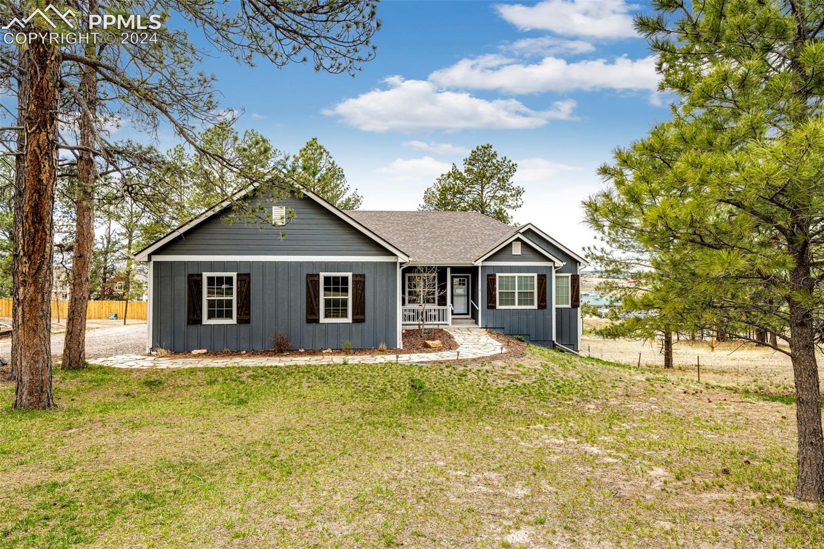 711 Pine Ridge Street Elizabeth, CO 80107 - Photo 1 of 39 Single story home with a front yard