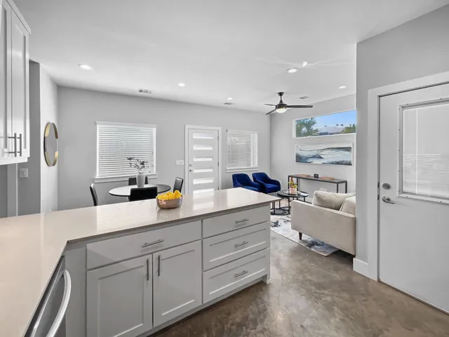 a living room with furniture and a table