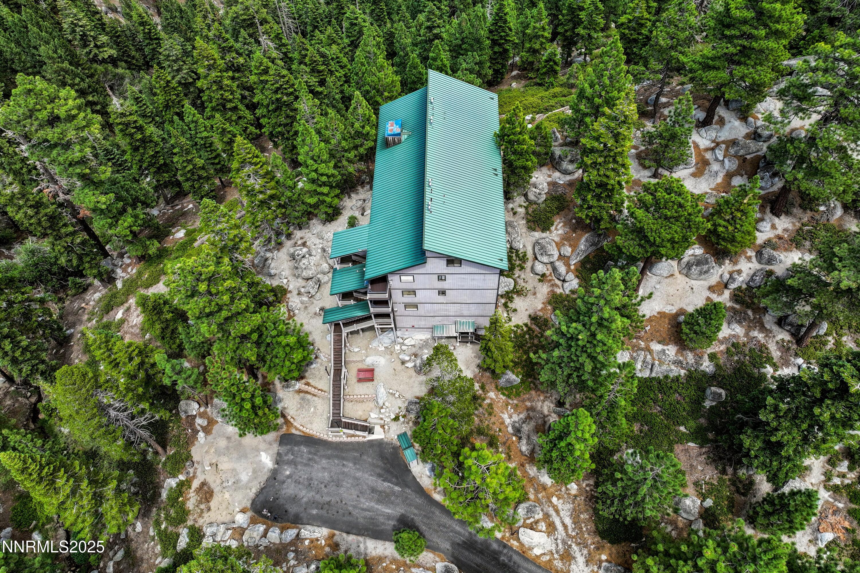 305 Galaxy Lane, Unit 5 Stateline, NV 89449 - Photo 29 of 56 an aerial view of a house with a yard and plants