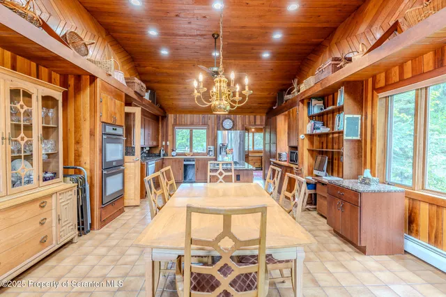 a bathroom with a sink mirror and shower