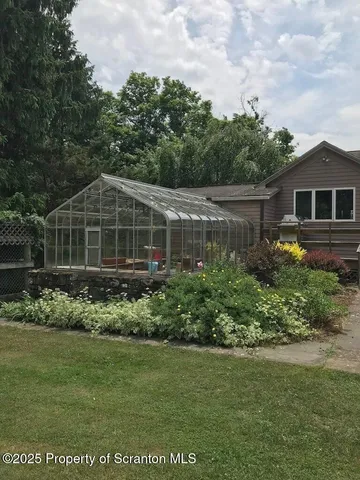 a bedroom with a bed and dresser in it