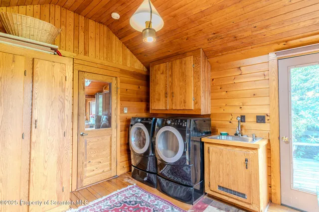 a bedroom with two beds and a dresser