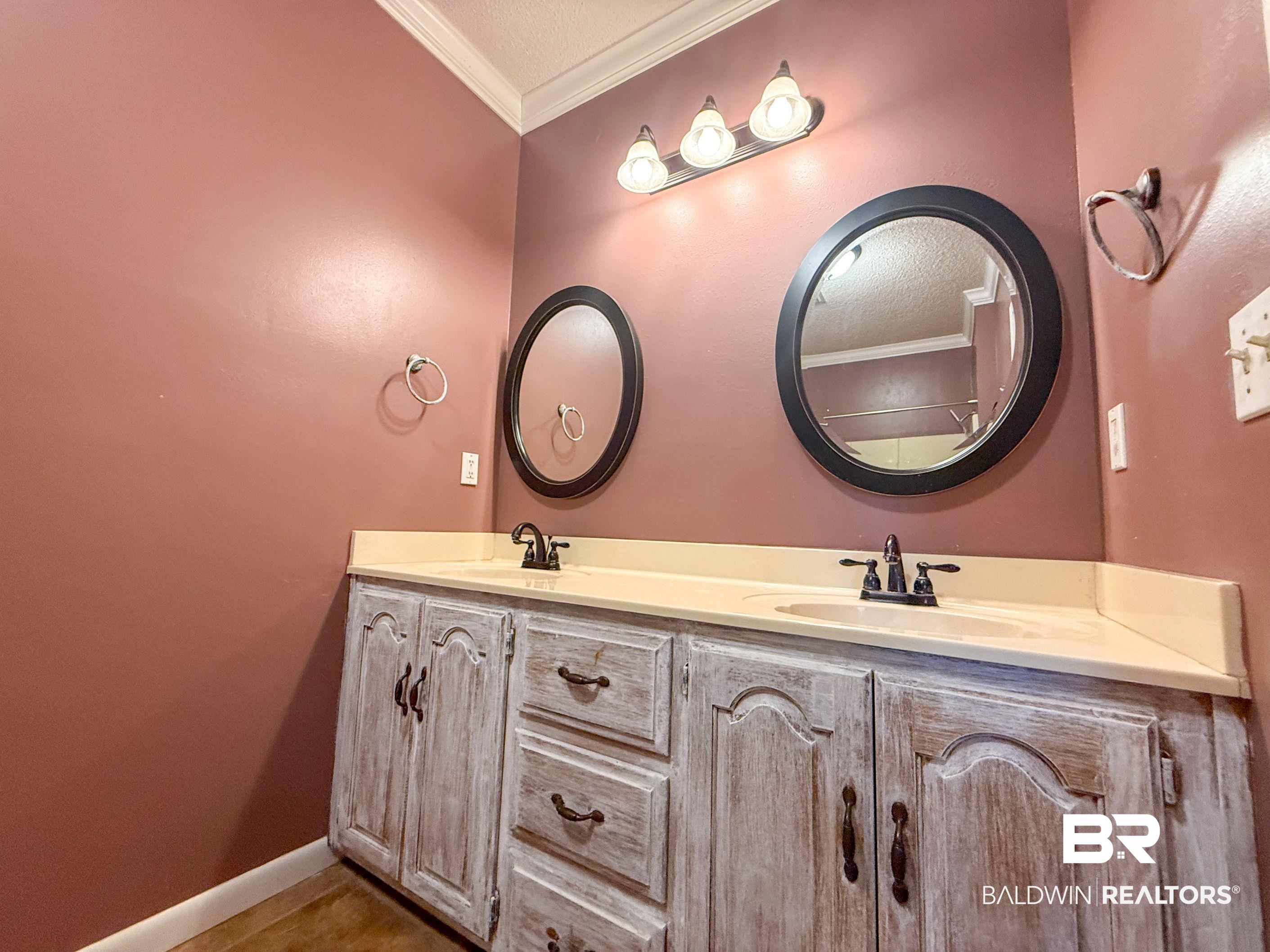 534 Buddy Lake Road Brewton, AL 36426 - Photo 15 of 32 Bathroom featuring ornamental molding and double vanity