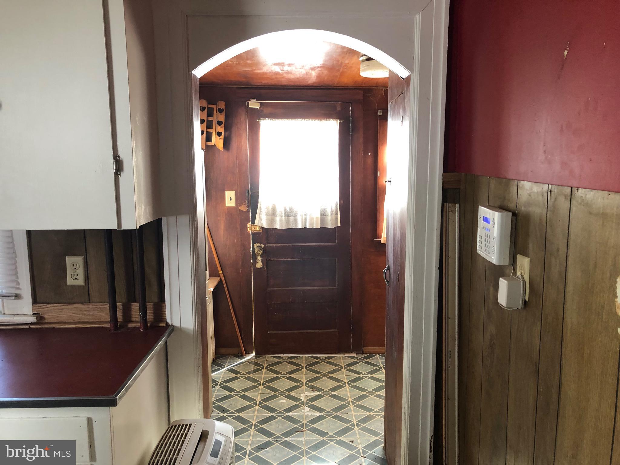 319 Atlantic Street Bridgeton, NJ 08302 - Photo 7 of 49 kitchen looking to back door