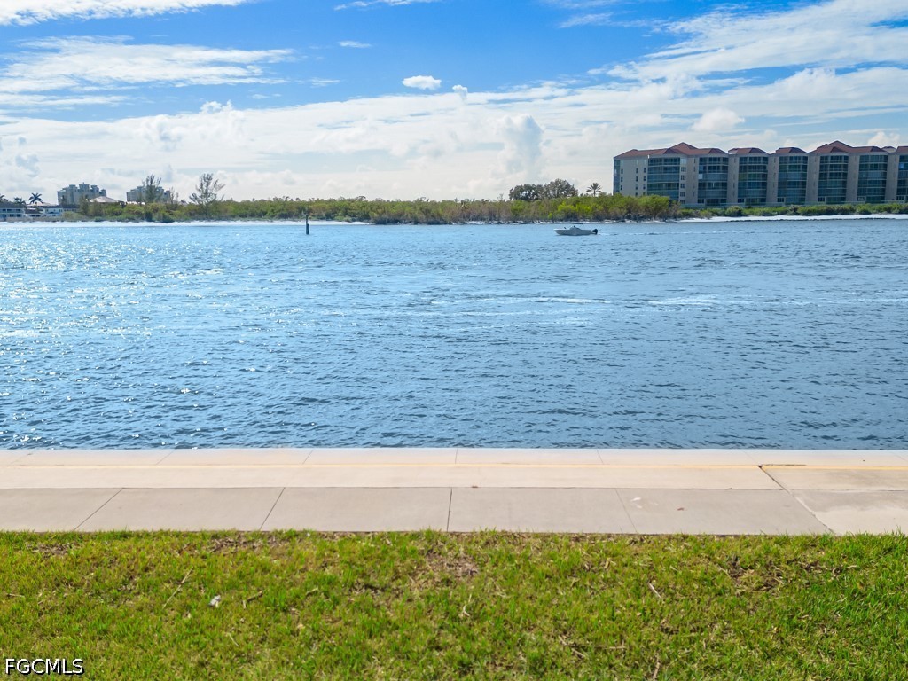 232 La Peninsula Boulevard, Unit 232 Naples, FL 34113 - Photo 33 of 44 a view of a yard