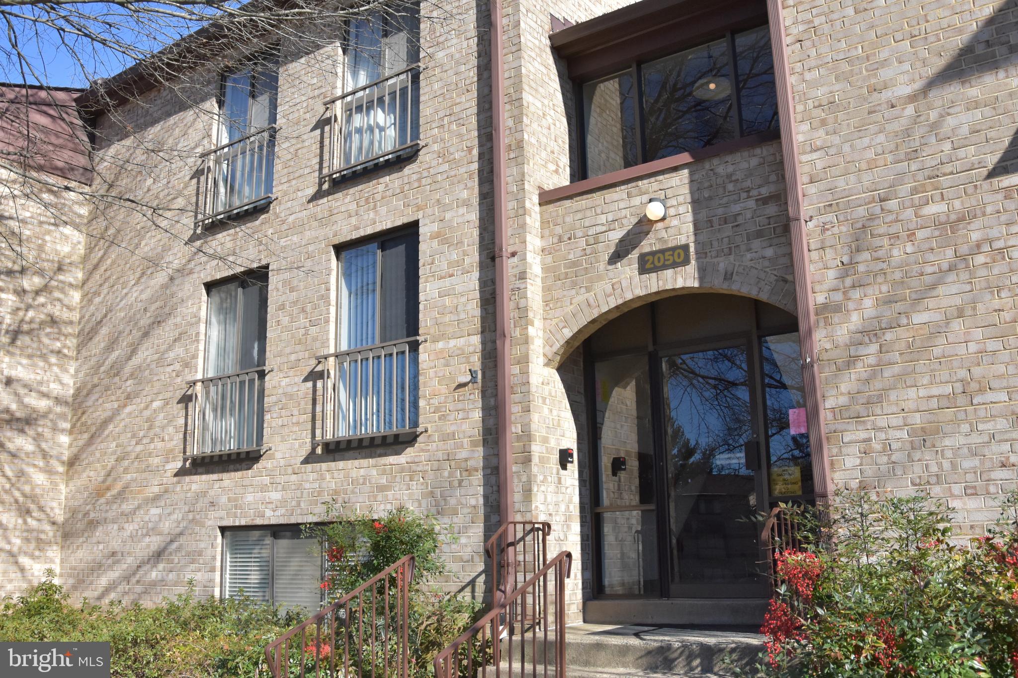 2050 Royal Fern Court, Unit 11A Reston, VA 20191 - Photo 1 of 17 a view of a wooden door of the building