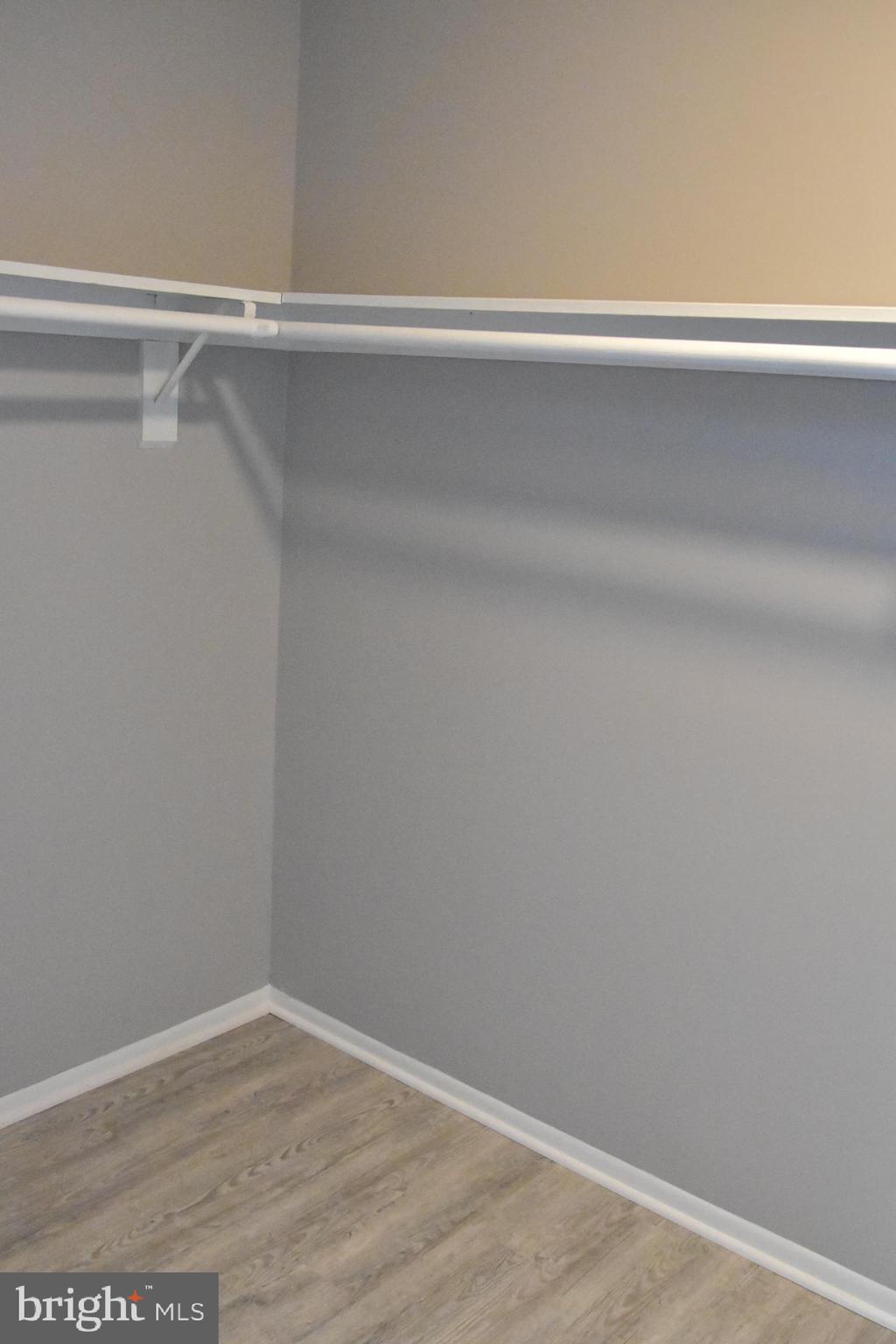 2050 Royal Fern Court, Unit 11A Reston, VA 20191 - Photo 11 of 17 a view of a closet with wooden floor